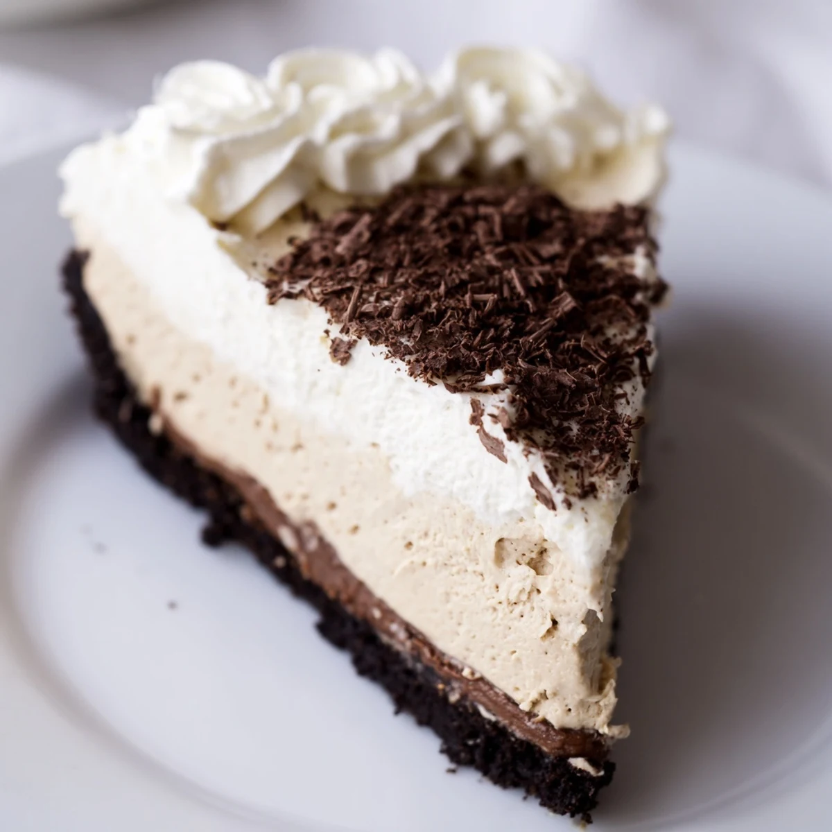 This Bailey Style Irish Cream Cheesecake has a smooth, creamy filling and a rich, chocolatey base, ready to serve.