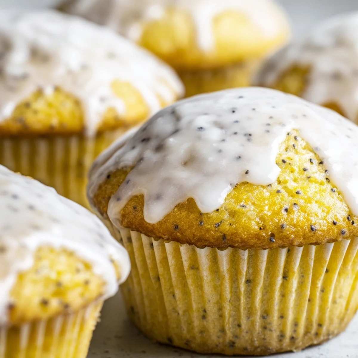 Lemon Poppy Seed Muffins with Glaze served on a wooden board, perfect for a sweet breakfast or afternoon snack.