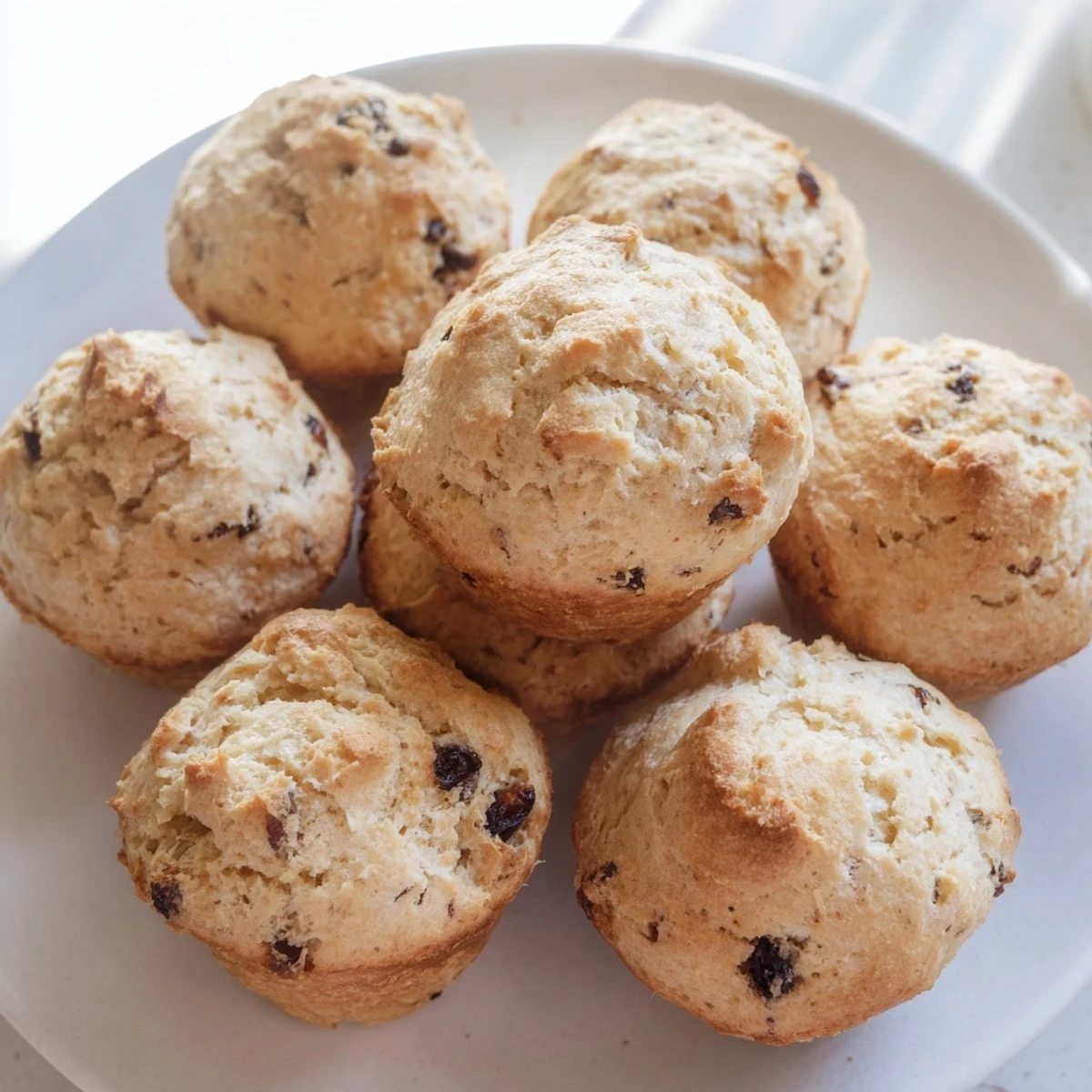 Golden-brown Mini Irish Soda Bread Muffins cooling on a wire rack, perfect for an Irish-inspired breakfast spread.