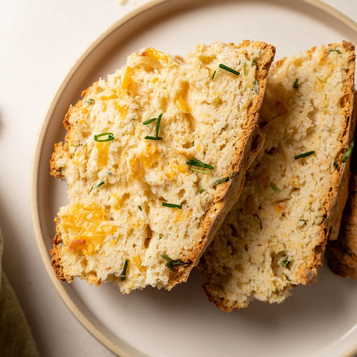 Rustic Savory Cheddar & Chive Irish Soda Bread offers a tender crumb, perfect with hot tomato soup.