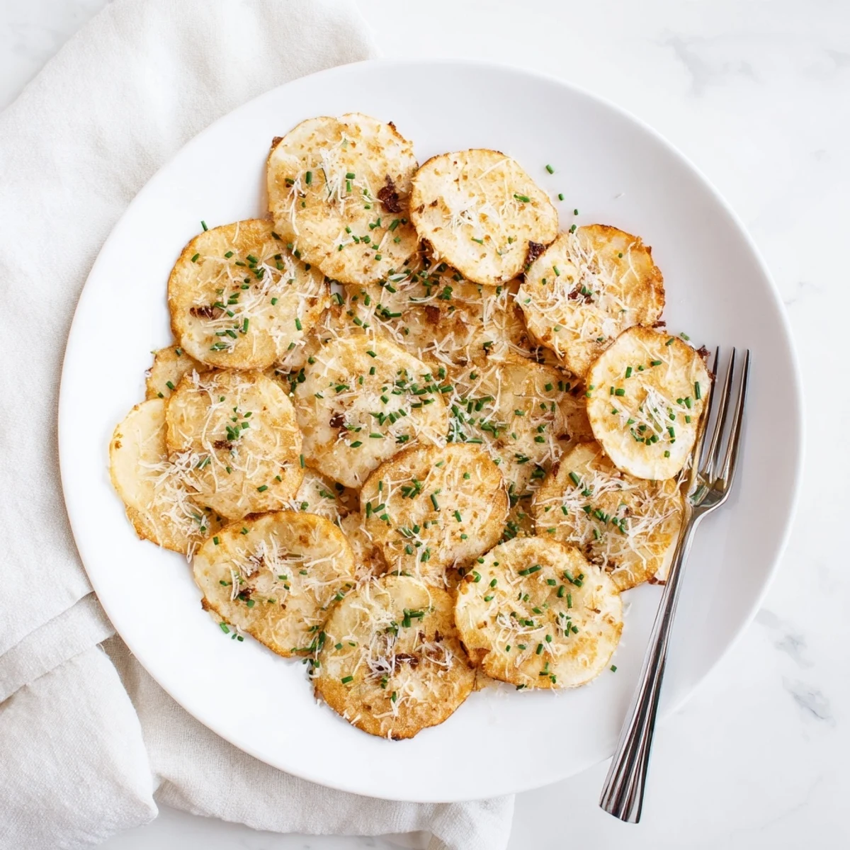 Protein-rich cottage cheese chips displaying golden edges and seasonings on a wire cooling rack