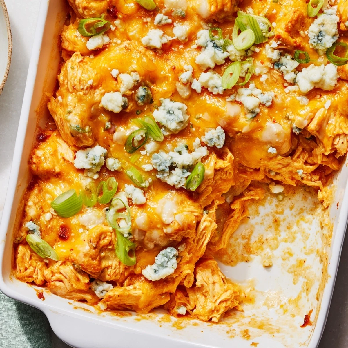 Golden bubbly Buffalo Chicken Cheese Bake fresh from oven with melted cheddar and mozzarella