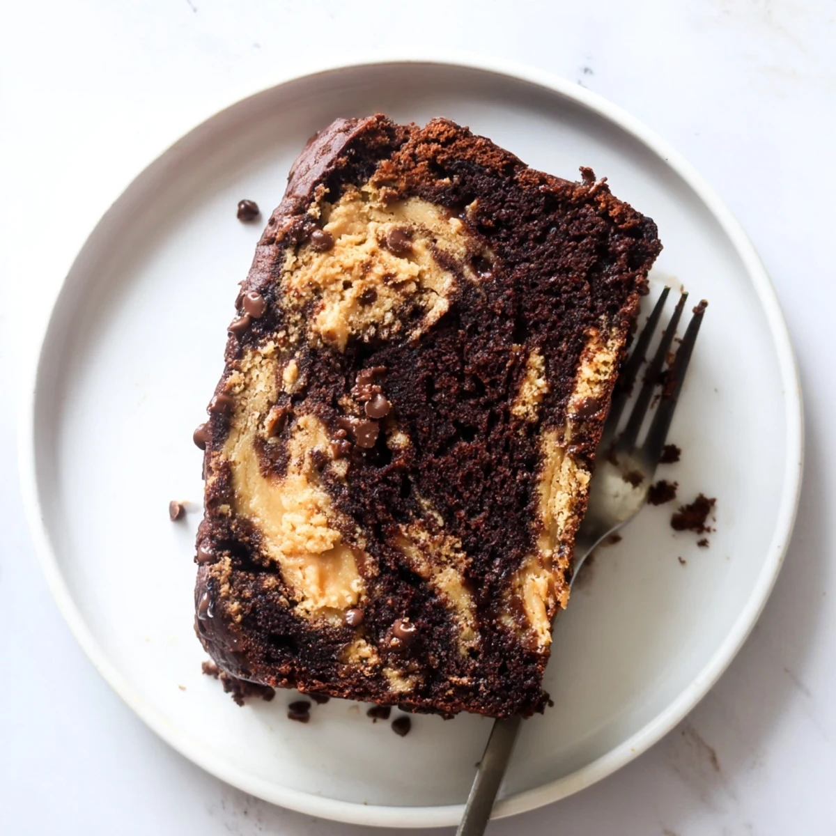 Freshly baked chocolate peanut butter banana bread loaf swirled with creamy peanut butter ribbons