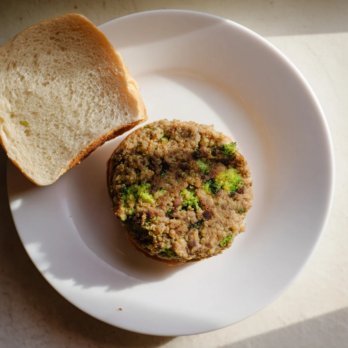 Protein-packed turkey broccoli and quinoa burgers on a gluten-free bun with avocado and crisp lettuce