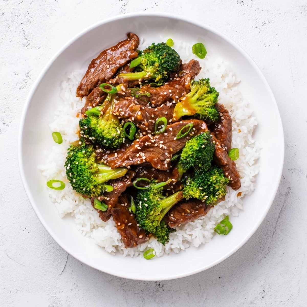 Slow cooker Beef and Broccoli with savory garlic-soy sauce and crisp tender broccoli florets
