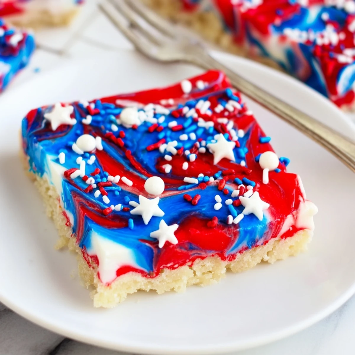 Serve warm Patriotic Sugar Cookie Bars with cold milk for summer celebrations
