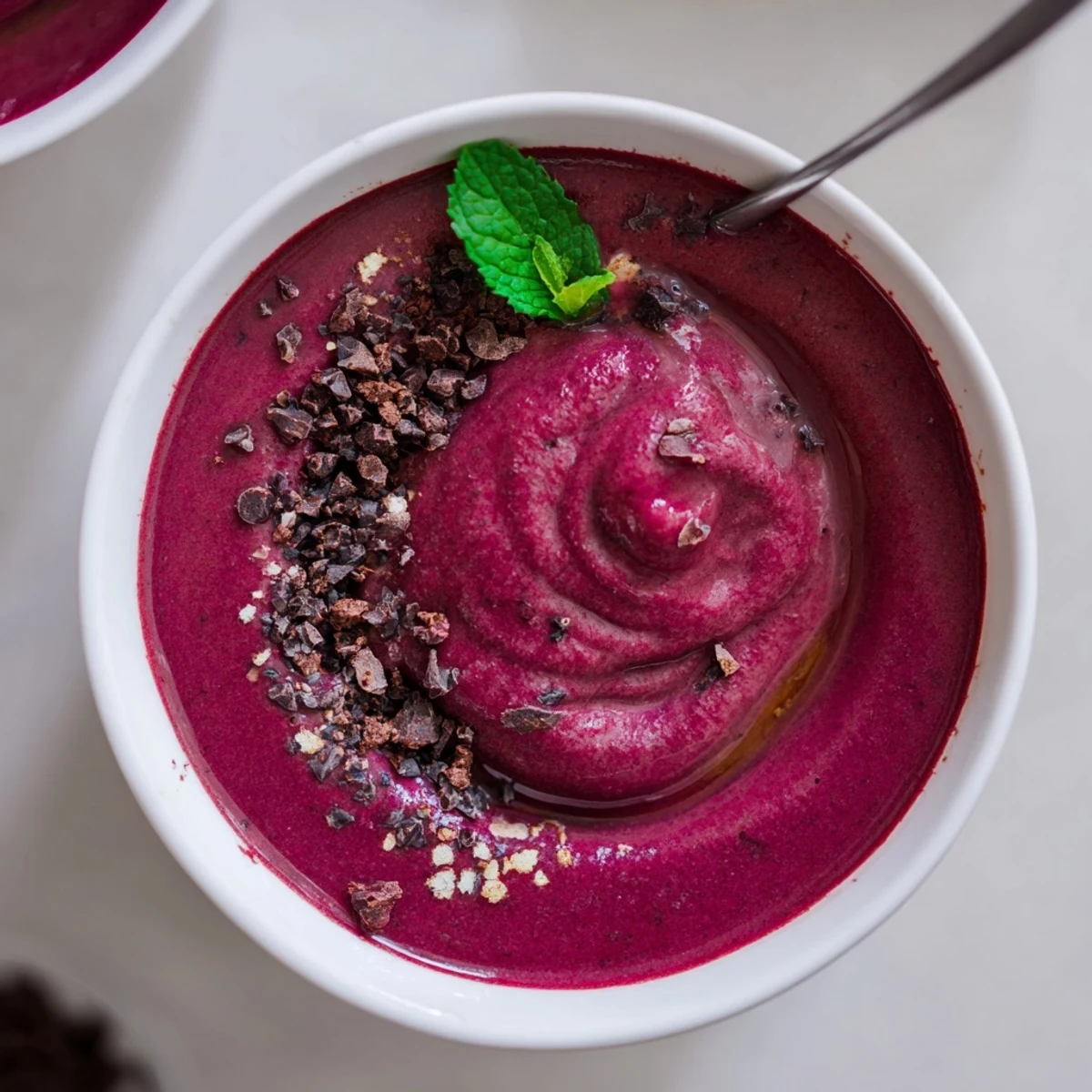 Chocolate Beet Smoothie in tall glass, velvety texture and earthy sweet aroma
