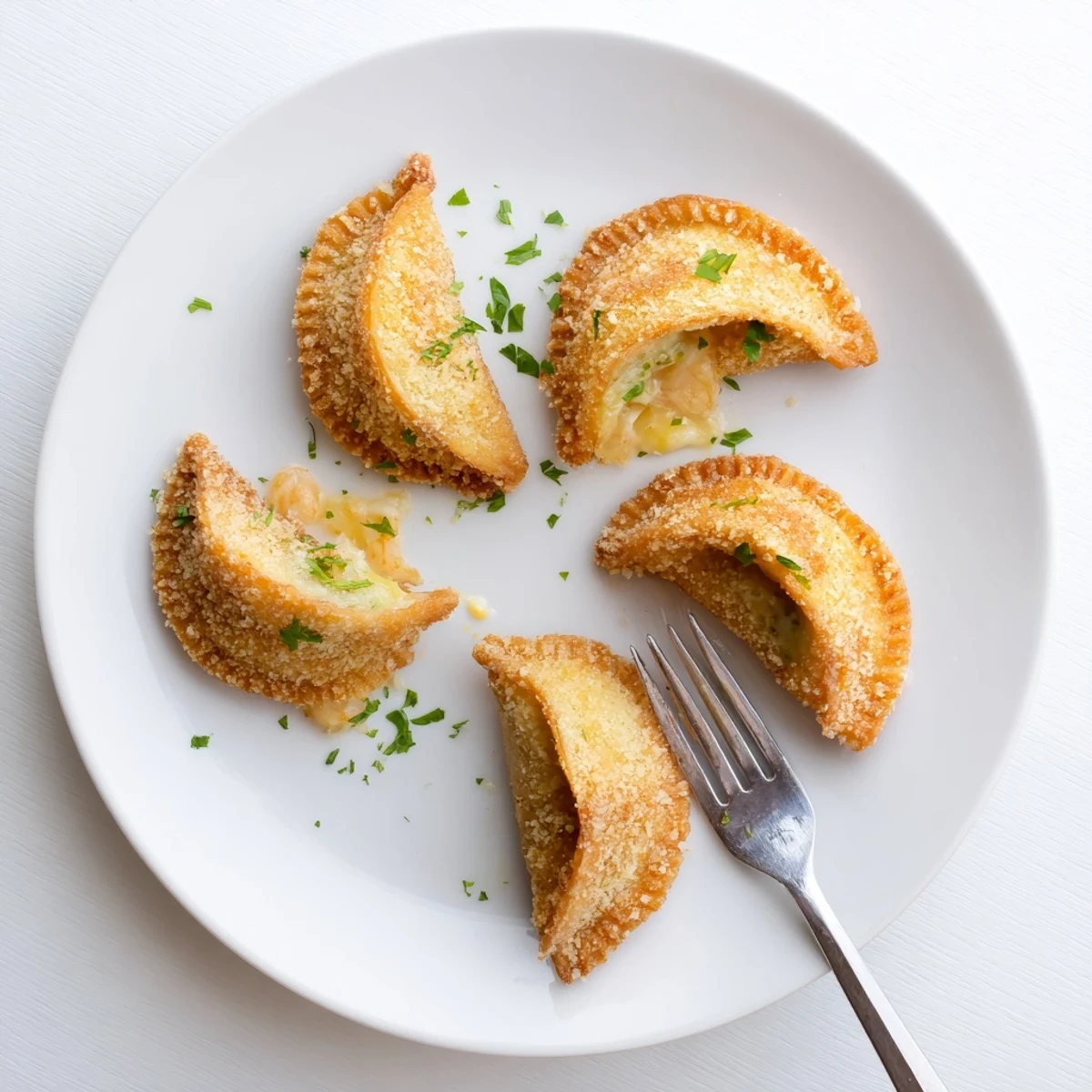 Freshly fried Portuguese shrimp rissois displaying golden crust and savory seafood filling perfect for appetizers