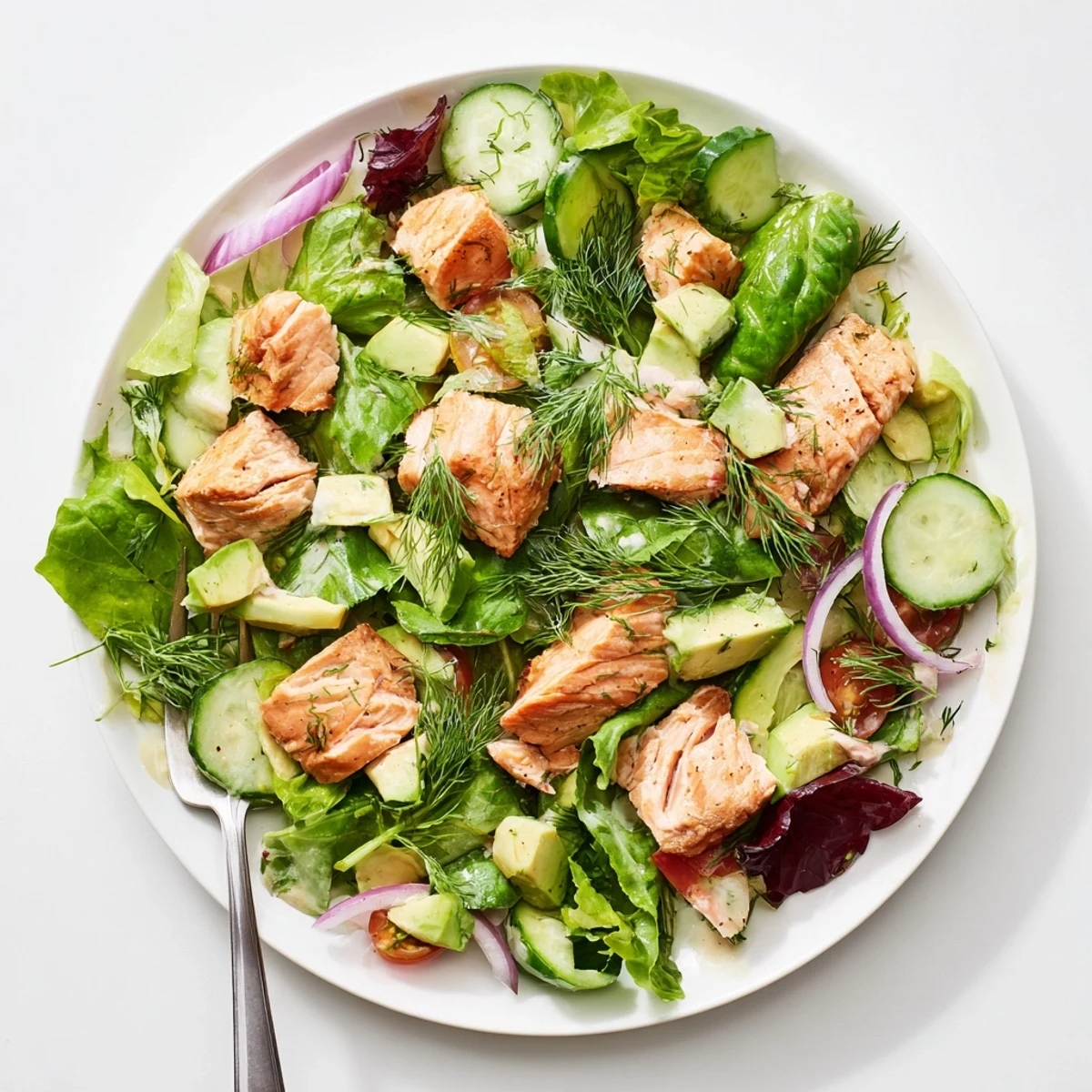Colorful ultimate salmon salad bowl featuring crisp vegetables, tender salmon pieces, and zesty homemade dressing for a healthy meal